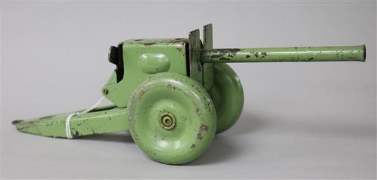 A green painted tinplate model of a Field Gun 22cm